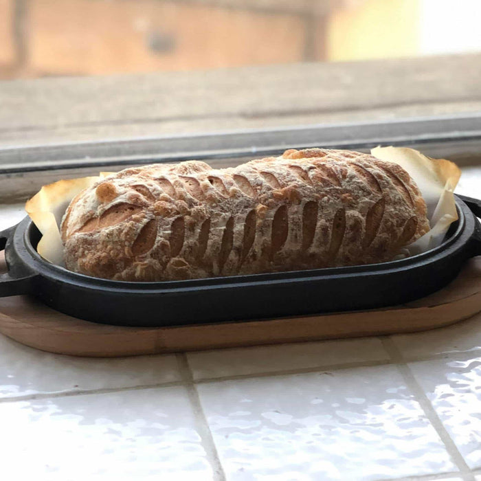 Bread baked into a cast iron pan using a cast-iron bread recipe