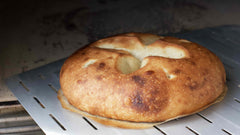 Olive Oil Bread on a perforated pizza peel 