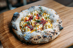 Strawberry Pimms Dessert Pizza on bamboo serving board