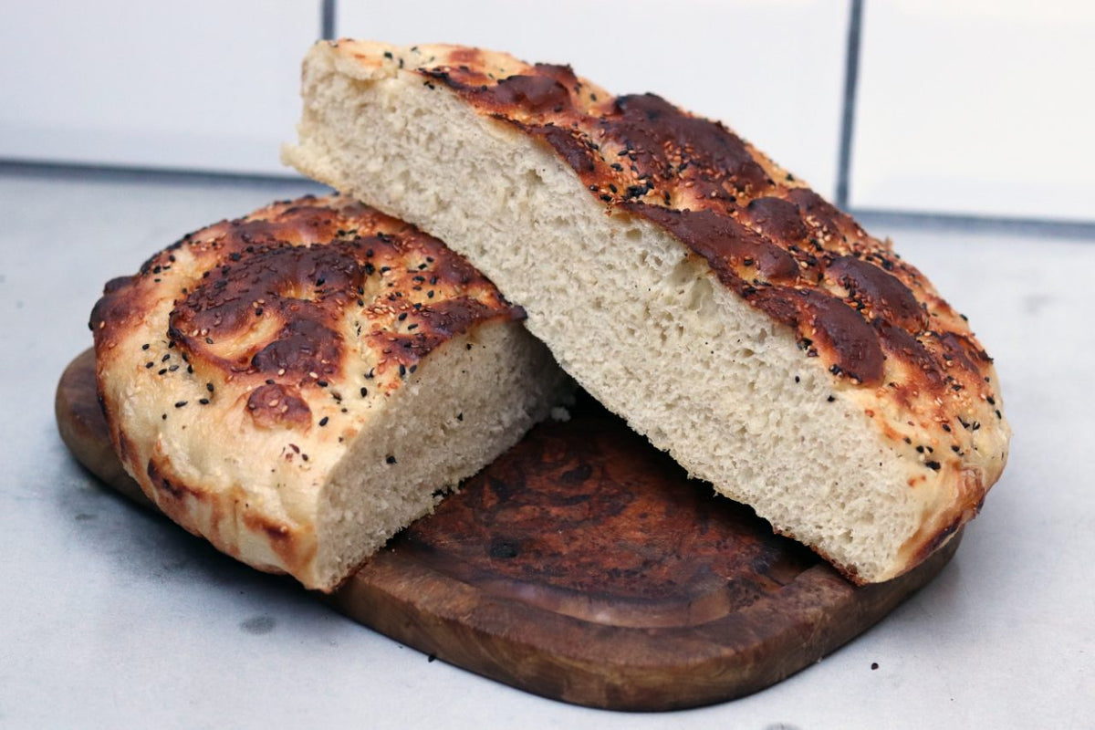 Traditional turkish wood fired stone brick oven and pita or pide bread  dough. This stone oven for Turkish pide or pita bread. Also known as Tandır  or Tandir Stock Photo