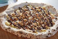 Chocolate, Caramel and Peanut Candy Bar Pizza