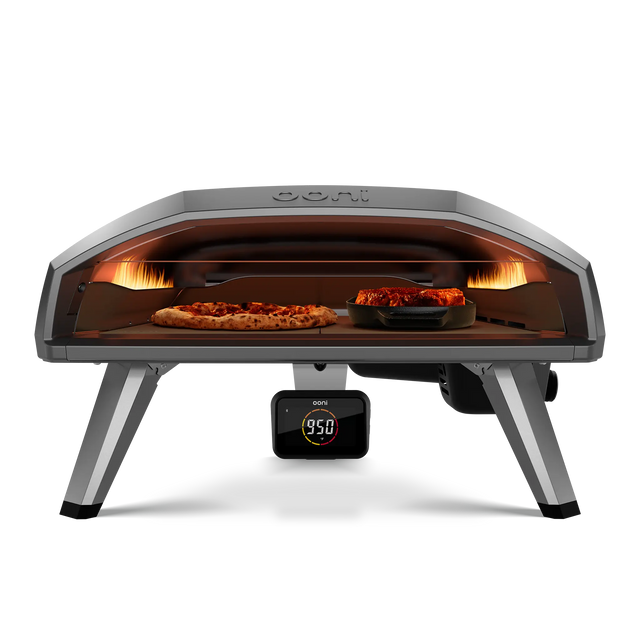 fornt view of Ooni koda 2 pro Pizza Oven with pizza and grizzler pan side by side 