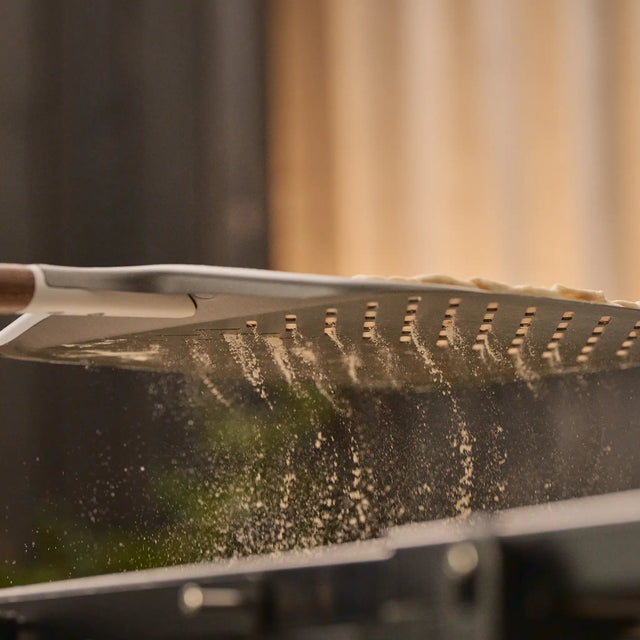 Close up of flour falling through signature peel perforations 