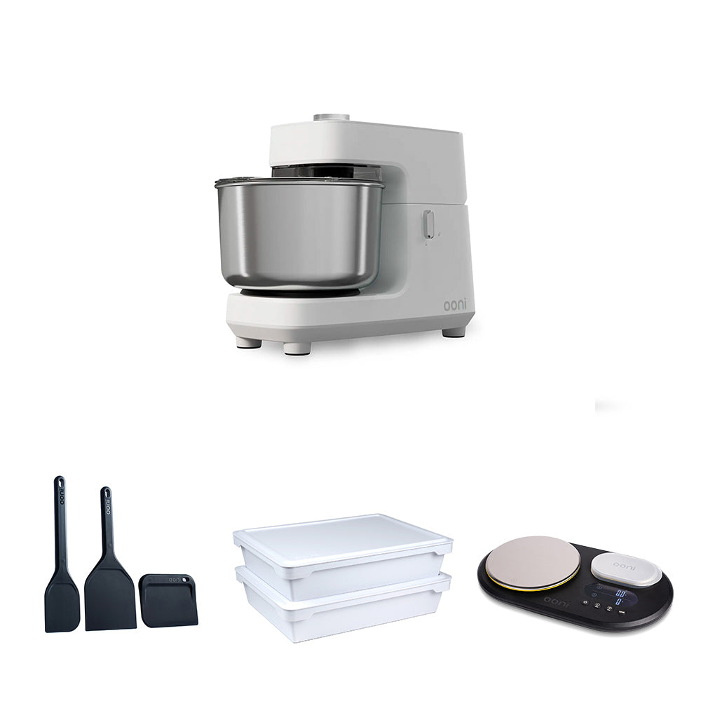 A white stand mixer with a stainless steel bowl is shown above three smaller accessories on a white background: two black spatulas, two white plastic storage containers, and a black digital scale  #variant-2