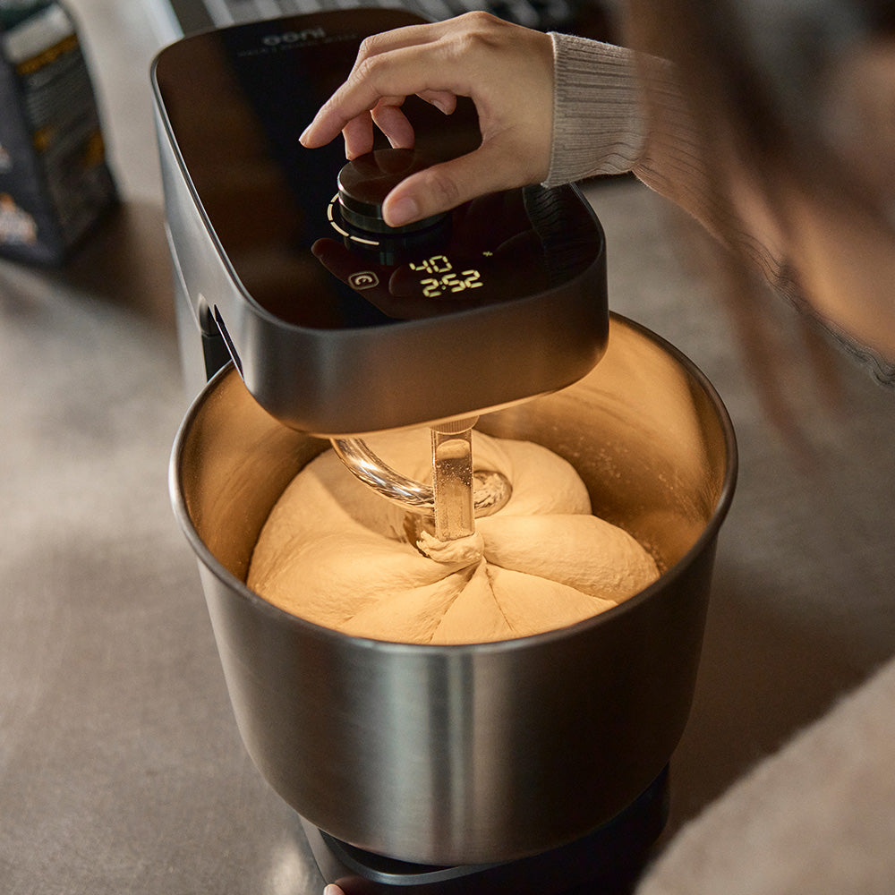 Ooni halo pro mixing dough with the spiral dough hook creating a pumpkin shape. 