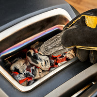 A close up image of charcoal being loaded into a Karu 12G