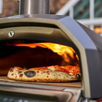 Close up of pizza cooking in a Karu 12G Pizza Oven