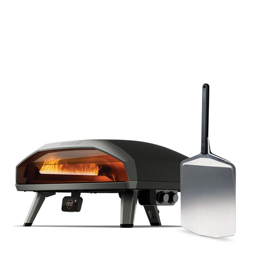 Ooni Koda 2 Max outdoor pizza oven with a pizza peel.