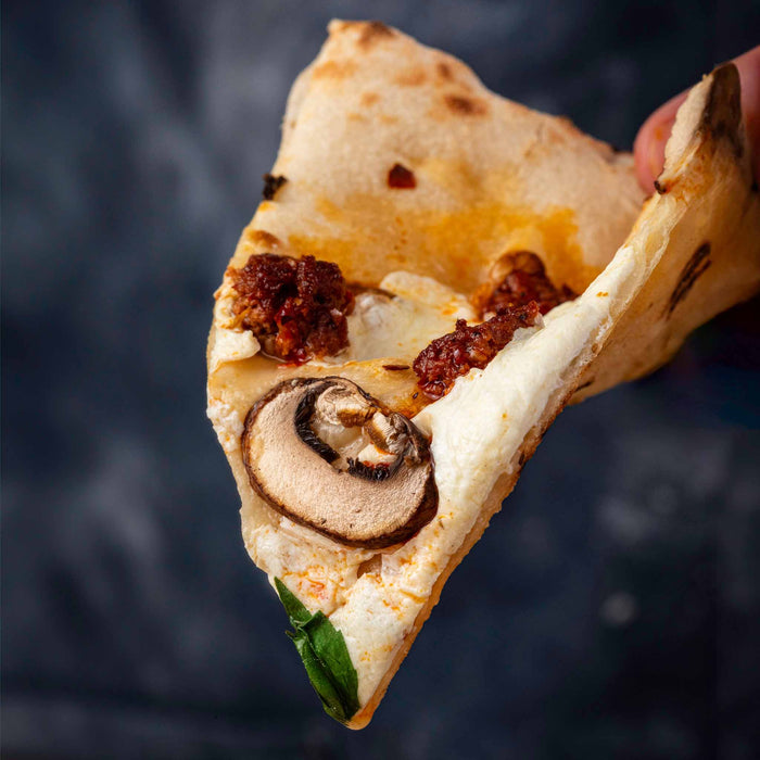 Salumi Chicago Nduja on pizza with cheese and mushrooms | Click this image to open up the product gallery modal. The product gallery modal allows the images to be zoomed in on.