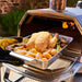 Ooni Roasting pan with chicken and vegtables in Ooni Karu 16