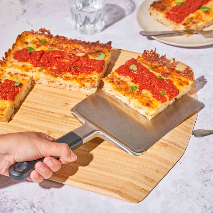 Ooni Pan Pizza Spatula on Ooni Bamboo Serving Board | Click this image to open up the product gallery modal. The product gallery modal allows the images to be zoomed in on.
