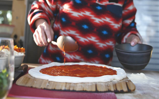 Pizza on a wooden peel
